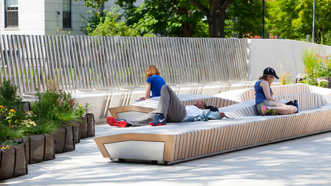 People relaxing on a bench