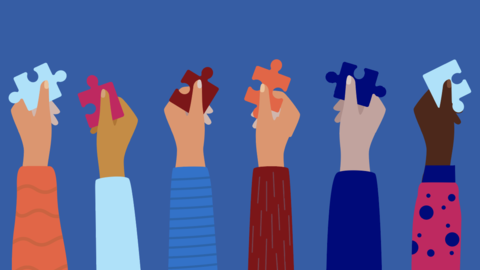 Hands with puzzle pieces