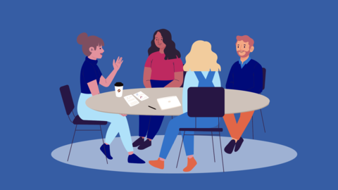 a group of people at a conference table