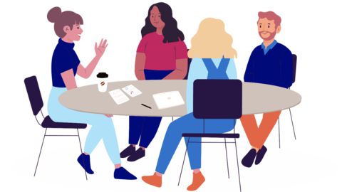 People sitting gathered around a table.