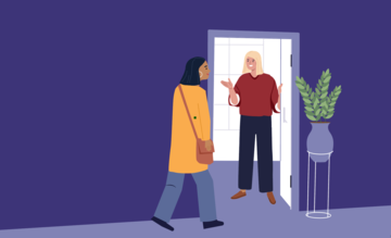 two people at an office doorway